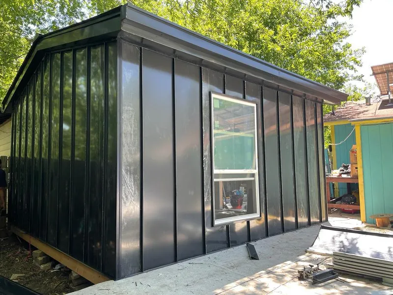 Black standing seam metal wall panels for Roof Inspection in Douglas